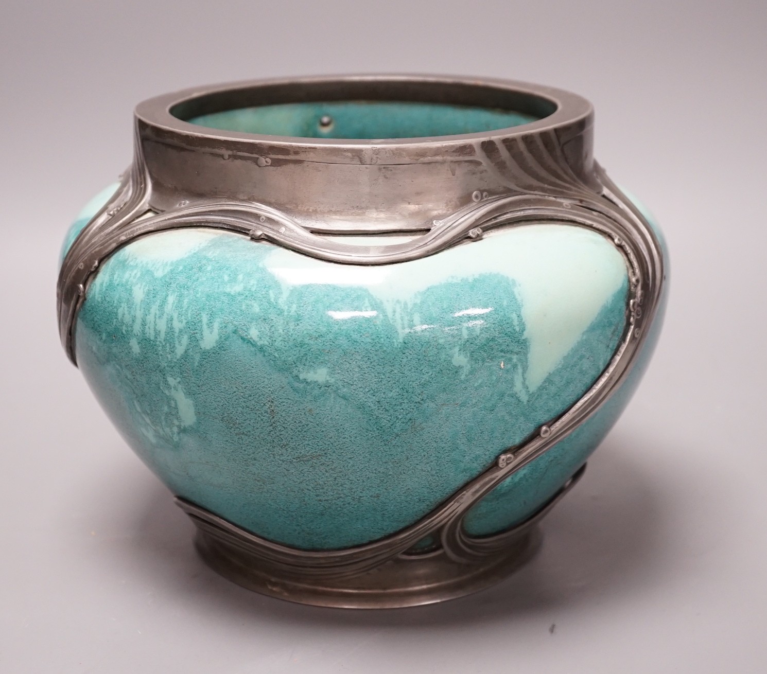 An Art Nouveau Orvit pewter mounted Ruskin style turquoise glazed jardiniere, 18cms high